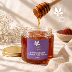 Kashmiri kesar infused pure honey in glass jar with saffron strands, honey dipper pouring honey, natural linen background